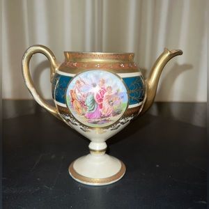 Porcelain, hand-painted mini cream/milk pot.